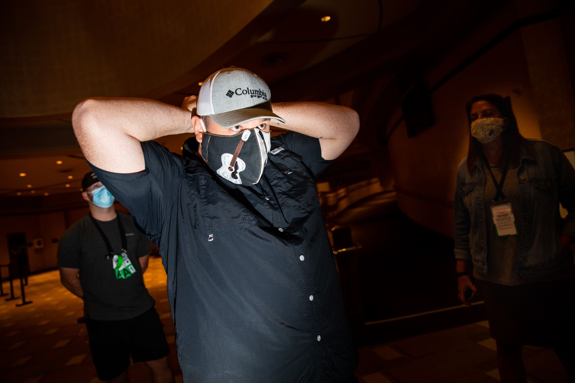 Luke Combs masks up with his custom PPE during the rehearsals. 