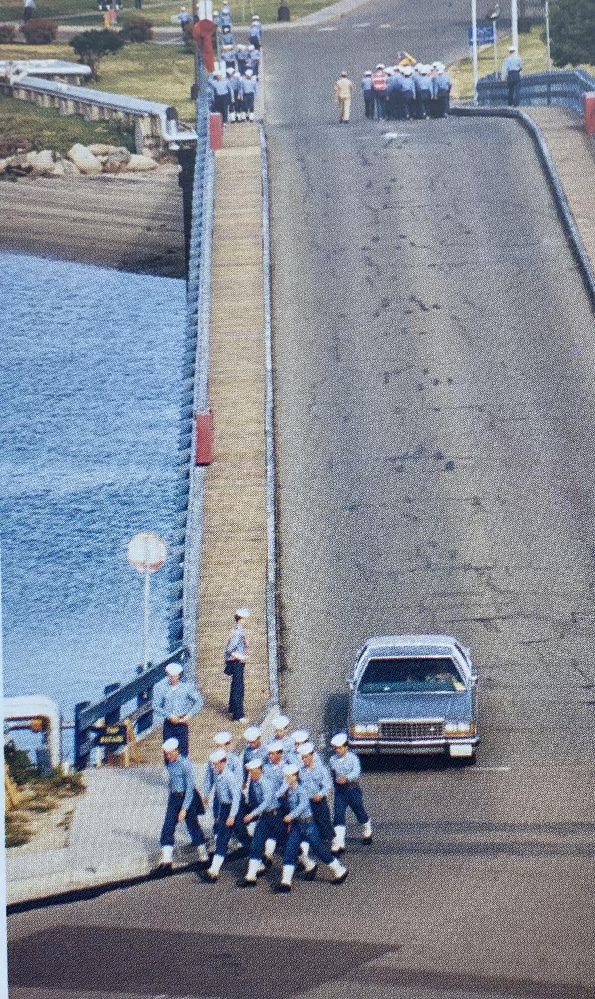 Recruits cross the bridge over the boat channel to Camp Nimitz in the 1960s.