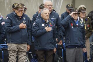 U.S. war veterans salute during a ceremony to mark the 79th anniversary of the assault that led to the liberation of France and Western Europe from Nazi control, at the American Cemetery in Colleville-sur-Mer, Normandy, France, Tuesday, June 6, 2023. The American Cemetery is home to the graves of 9,386 United States soldiers. Most of them lost their lives in the D-Day landings and ensuing operations. (AP Photo/Thomas Padilla)