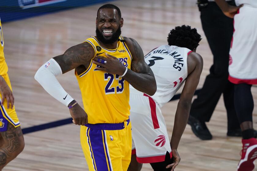 The Lakers' LeBron James reacts after a play against the Toronto Raptors during the second half Aug. 1, 2020.