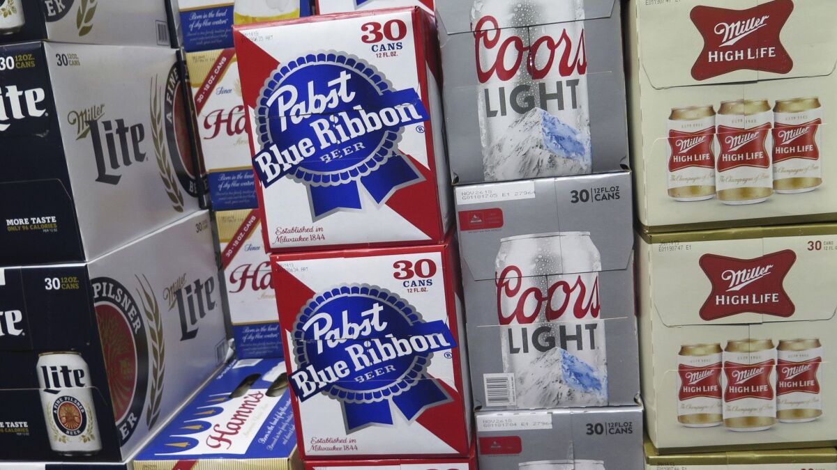Cases of Pabst Blue Ribbon and Coors Light in a liquor store. Pabst Brewing Co. and MillerCoors are locked in a dispute over a long-term brewing partnership.