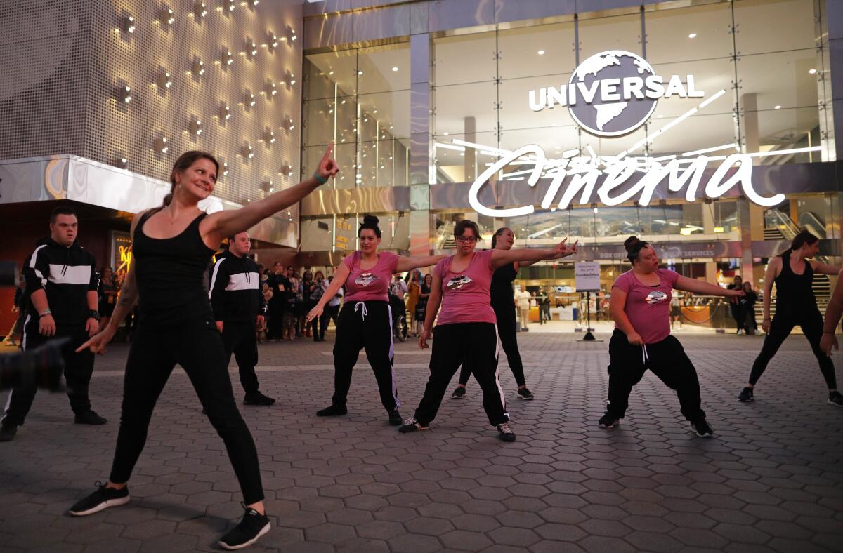 Down for Dance,” a dance group of individuals with Down syndrome, performs for visitors during the Reelabilities Film Festival at Universal Cinema.