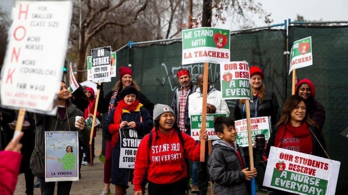 Educators, parents and others picket in support of UTLA at Eagle Rock Junior/Senior High School on Tuesday.