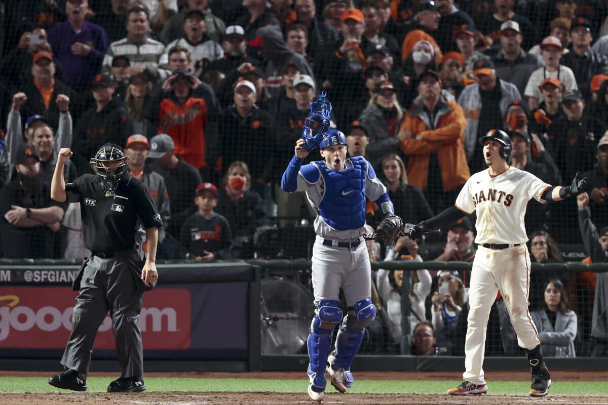 The San Francisco Giants' Wilmer Flores reacts after a called strike for a strike out.