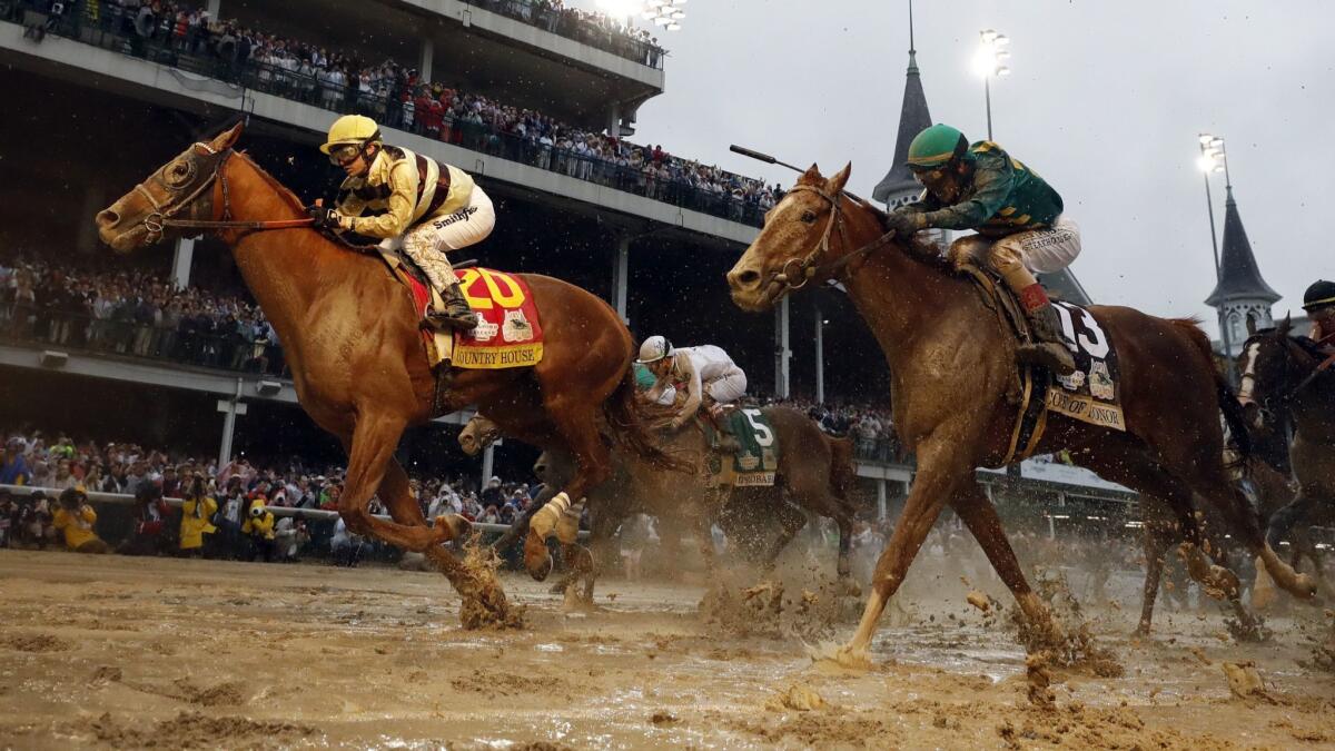 Flavien Prat rides Country House to the finish line during the 145th running of the Kentucky Derby on May 4.