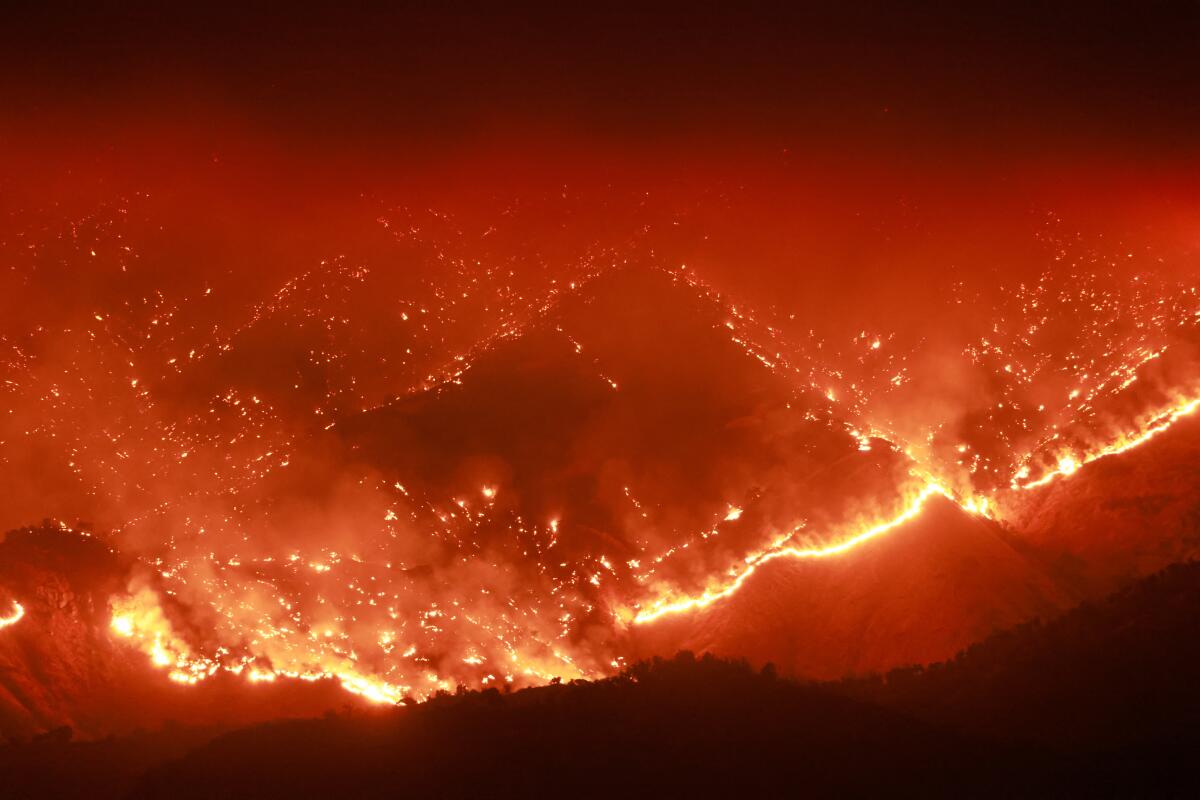Embers glow as the Basin fire burns in the Sierra National Forest in Fresno County.