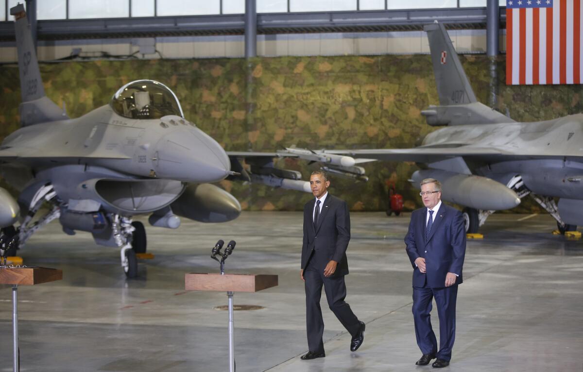 President Obama and Polish President Bronislaw Komorowski announced measures to boost Eastern Europe's defenses Tuesday after touring joint U.S.-Polish military operations in Warsaw.