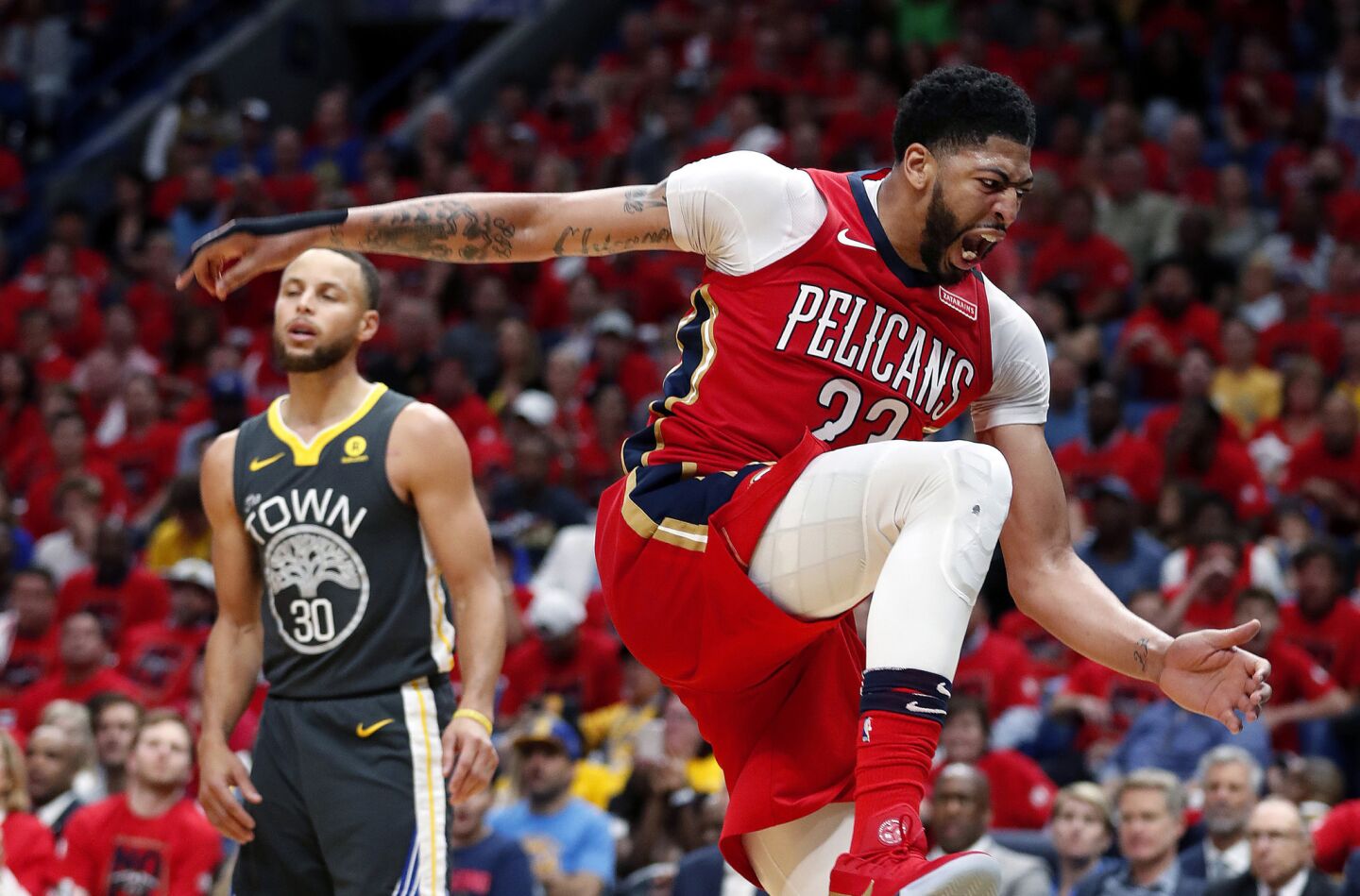 Pelicans forward Anthony Davis reacts after a slam dunk during the second half of Game 3 of a second-round NBA basketball playoff series against the Golden State Warriors on May 4, 2018.