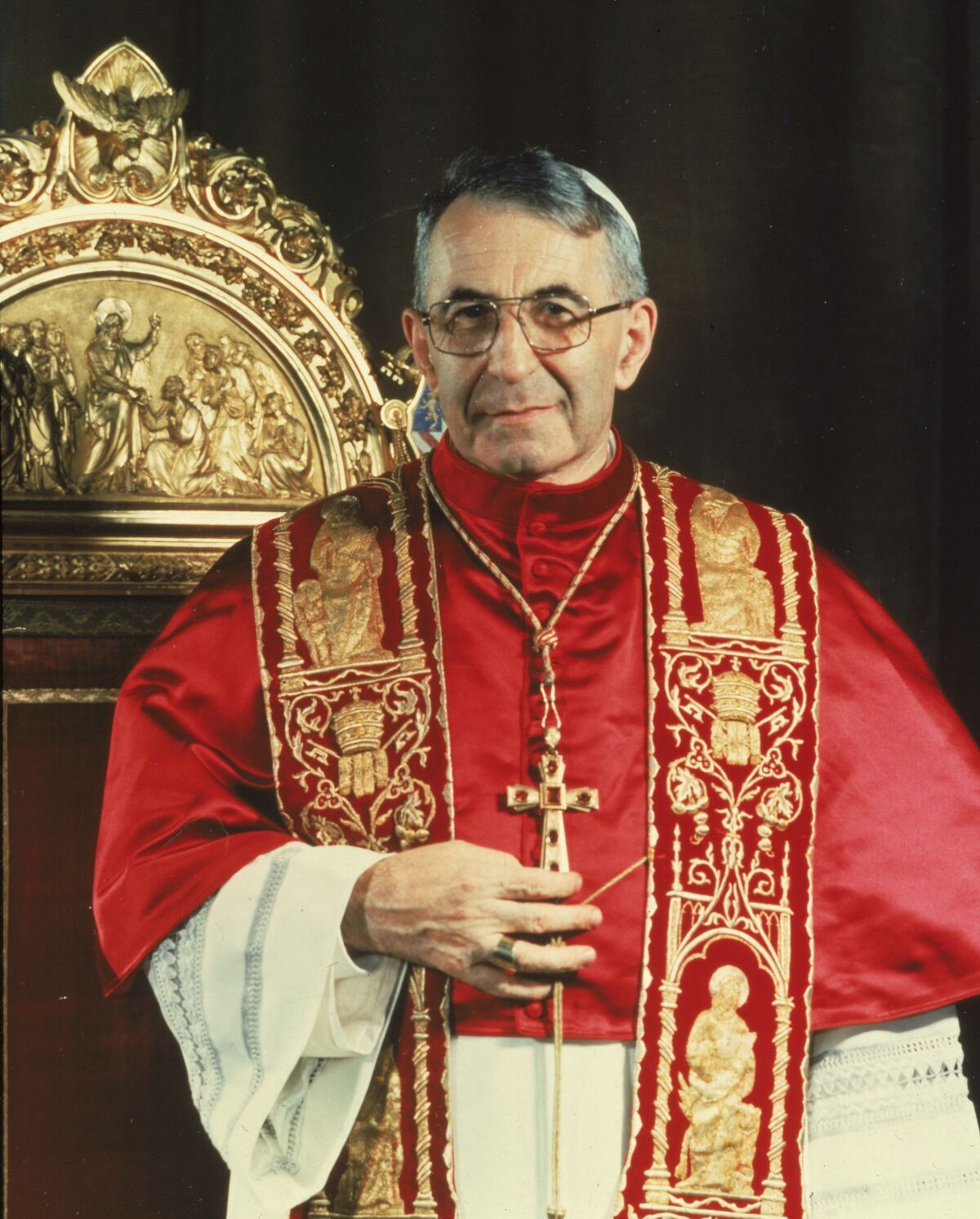 A 1978 photo of Pope John Paul I standing before the papal throne in Vatican City. Pope Francis has approved crediting a miraculous healing to one of his late predecessors, John Paul I. Francis' signing off on the 2011 recovery in Argentina of a child moves John Paul I along the path toward possible sainthood. John Paul was pontiff from Sept. 3 till Sept. 28, 1978, when he was found dead in his bed. (AP Photo)