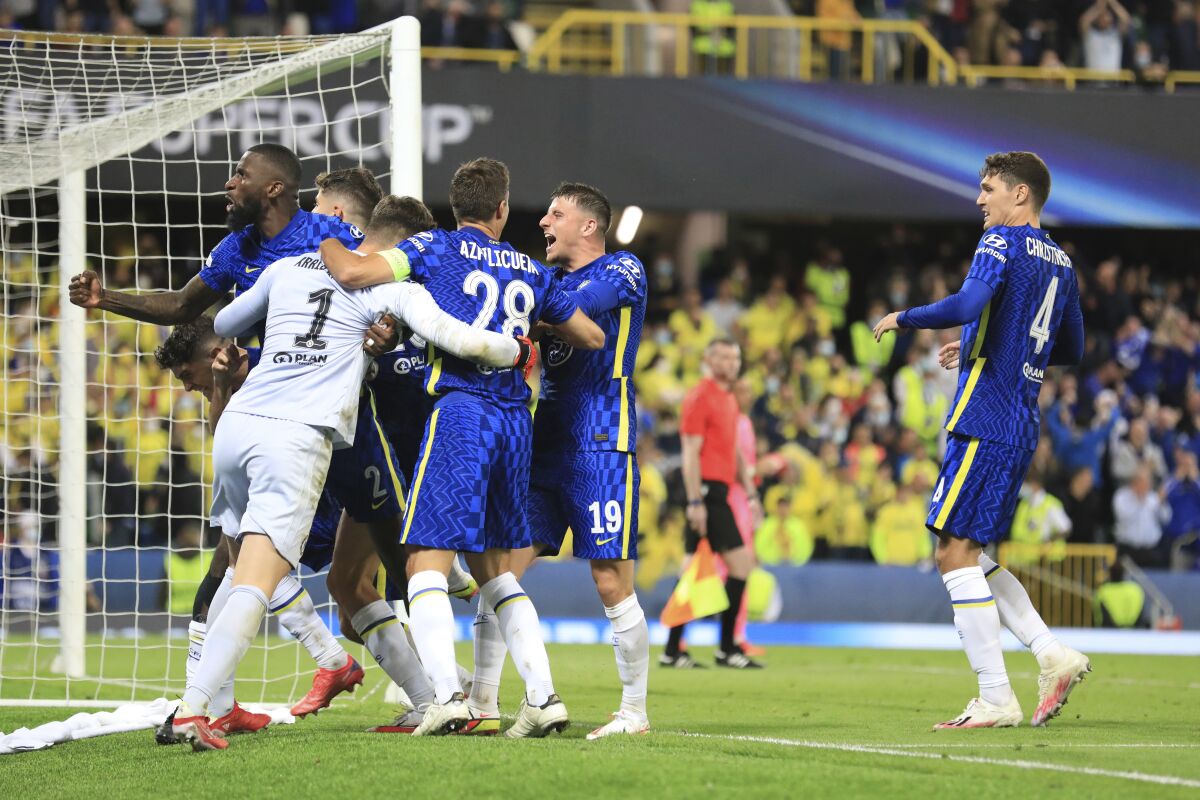 Chelsea's goalkeeper Kepa Arrizabalaga celebrates with team mates after the penalty shootout of the UEFA Super Cup soccer match between Chelsea and Villarreal at Windsor Park in Belfast, Northern Ireland, Wednesday, Aug. 11, 2021. (AP Photo/Peter Morrison)