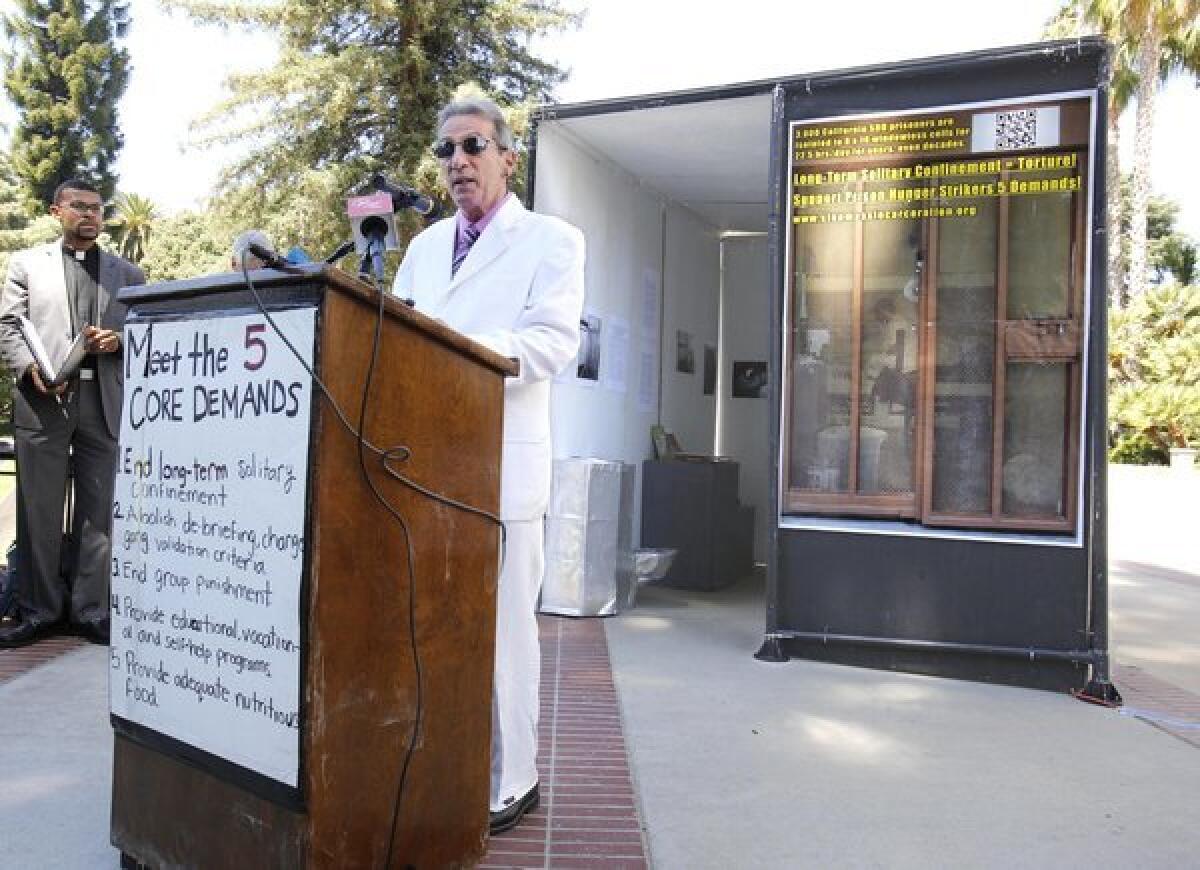 Speaking in front of a replica of a Secure Housing Unit cell, Assemblyman Tom Ammiano (D-San Francisco) speaks at a rally at the Capitol in Sacramento calling for the end of solitary confinement in California prisons.
