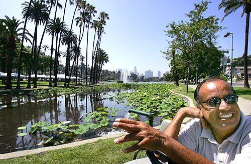 Philip Molina, senior gardener at Echo Park Lake talks about the lotus bloom this year at the park.
