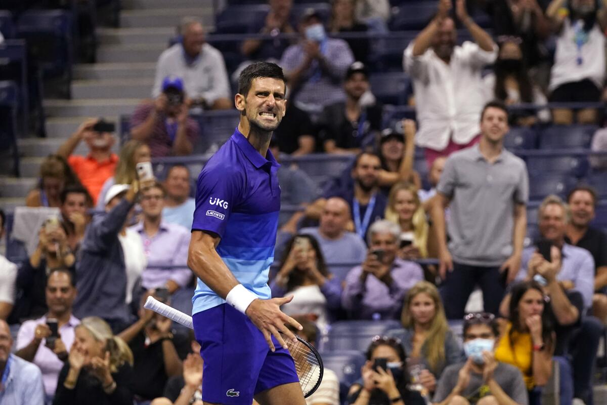 Novak Djokovic, of Serbia, reacts after scoring a point against Matteo Berrettini, of Italy, during the quarterfinals of the U.S. Open tennis tournament early Thursday, Sept. 9, 2021, in New York. (AP Photo/Frank Franklin II)