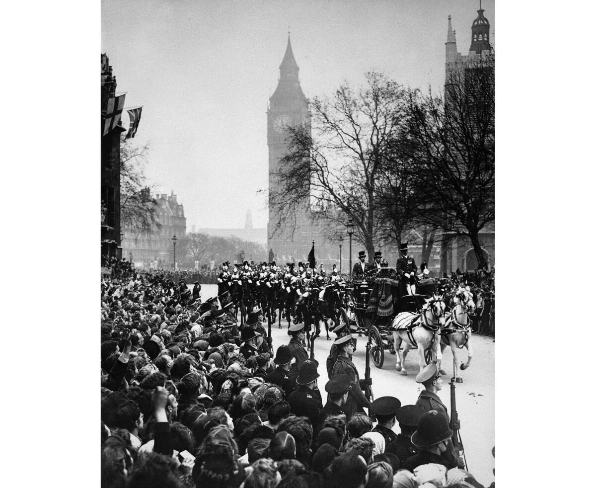 The Irish Coach escorted by the Household Cavalry and carrying Princess Elizabeth and King George VI arrives at the west door to Westminster Abbey.