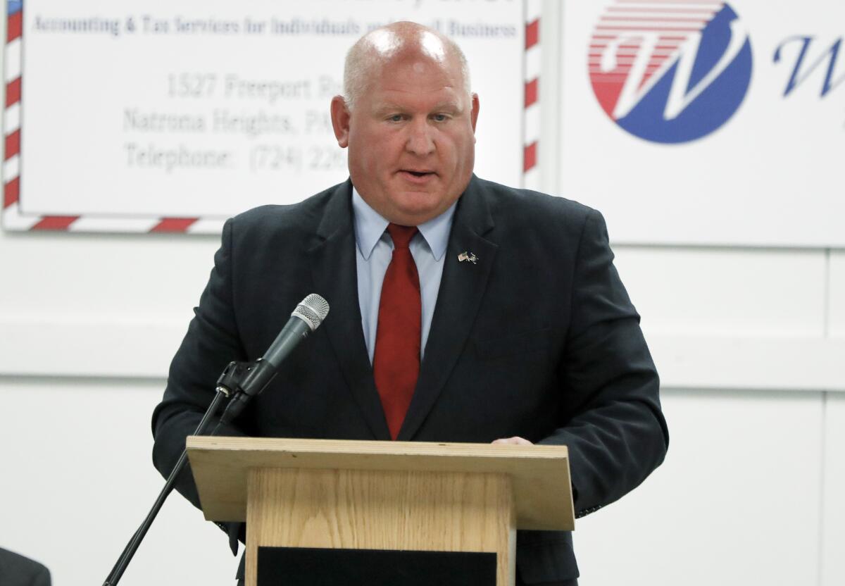 Rep. Glenn Thompson stands at a lectern.