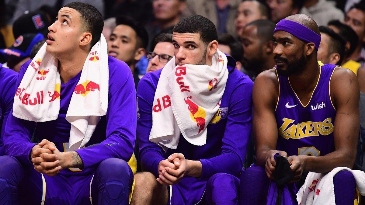 Lonzo Ball, center, remains the Lakers' starting point guard, though the rookie's struggles sometimes send him to the bench.