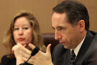 State Sen. Joe Dunn, D-Orange, right questions insurance industry representative Mark Sektnan, as Sen. Gloria Romero, D-Los Angeles, left, looks on during a hearing of the Senate Labor and Industrial Relations committee at the Capitol in Sacramento, Calif., Monday, Nov. 24, 2003. The committee is holding a series of hearings on the impact of workers' comp cost-cutting legislation adopted earlier this year and Gov. Arnold Schwarzenegger's demand for another $11 billion in cutbacks. (AP Photo/Rich Pedroncelli)