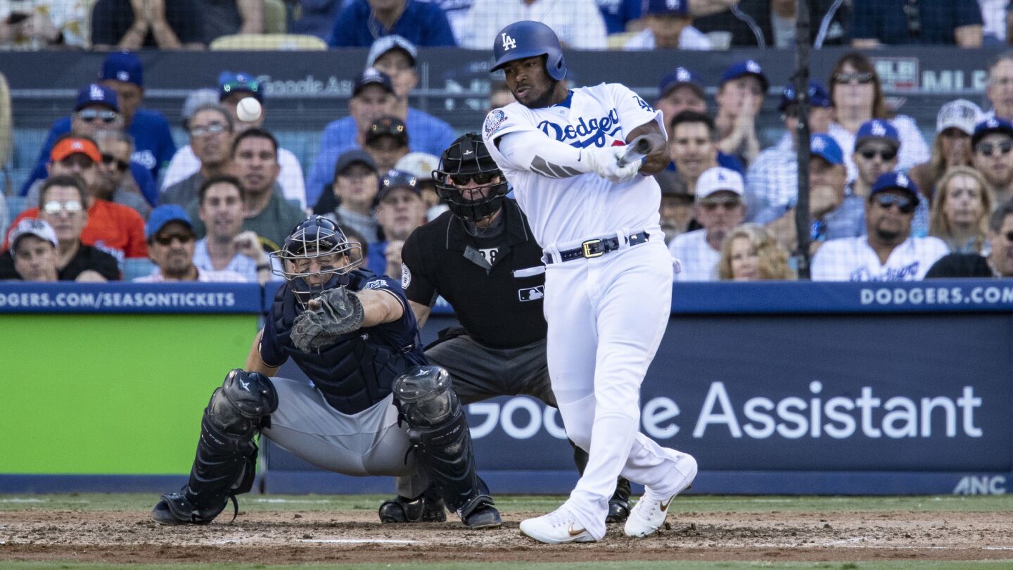 Dodgers right fielder Yasiel Puig hits an RBI single scoring Los Angeles Dodgers shortstop Manny Machado in the sixth inning.