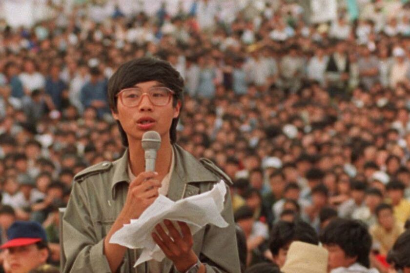 FILE - This May 27, 1989, file photo shows student leader Wang Dan in Tiananmen Square in Beijing, calling for a city wide march. Wang is urging Western nations to restore the link between human rights and trade with China during a press conference in Tokyo Wednesday, May 29, 2019, days ahead of the 30th anniversary of the 1989 student pro-democracy protests centered on Beijing's Tiananmen Square, of which he was a key leader. (AP Photo/Mark Avery, File)