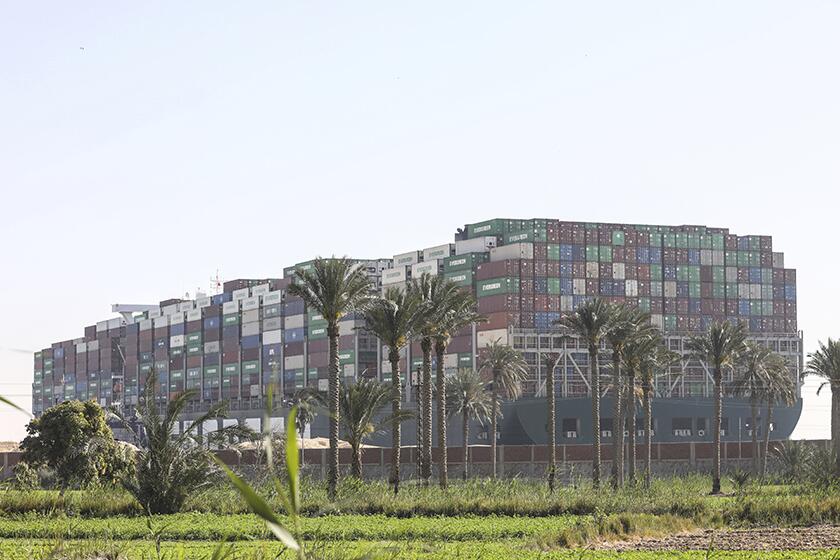 The cargo ship Ever Given remained wedged across the Suez Canal on Saturday.