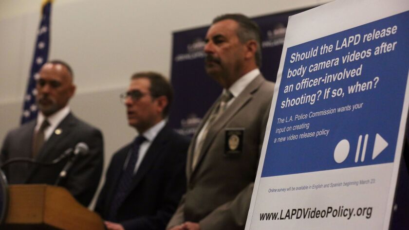 Matt Johnson, from left, then-president of the Police Commission, Barry Friedman, the director of NYU's Policing Project, and LAPD Chief Charlie Beck speak to reporters earlier this year about their plan to collect public feedback on how and when LAPD videos might be released.