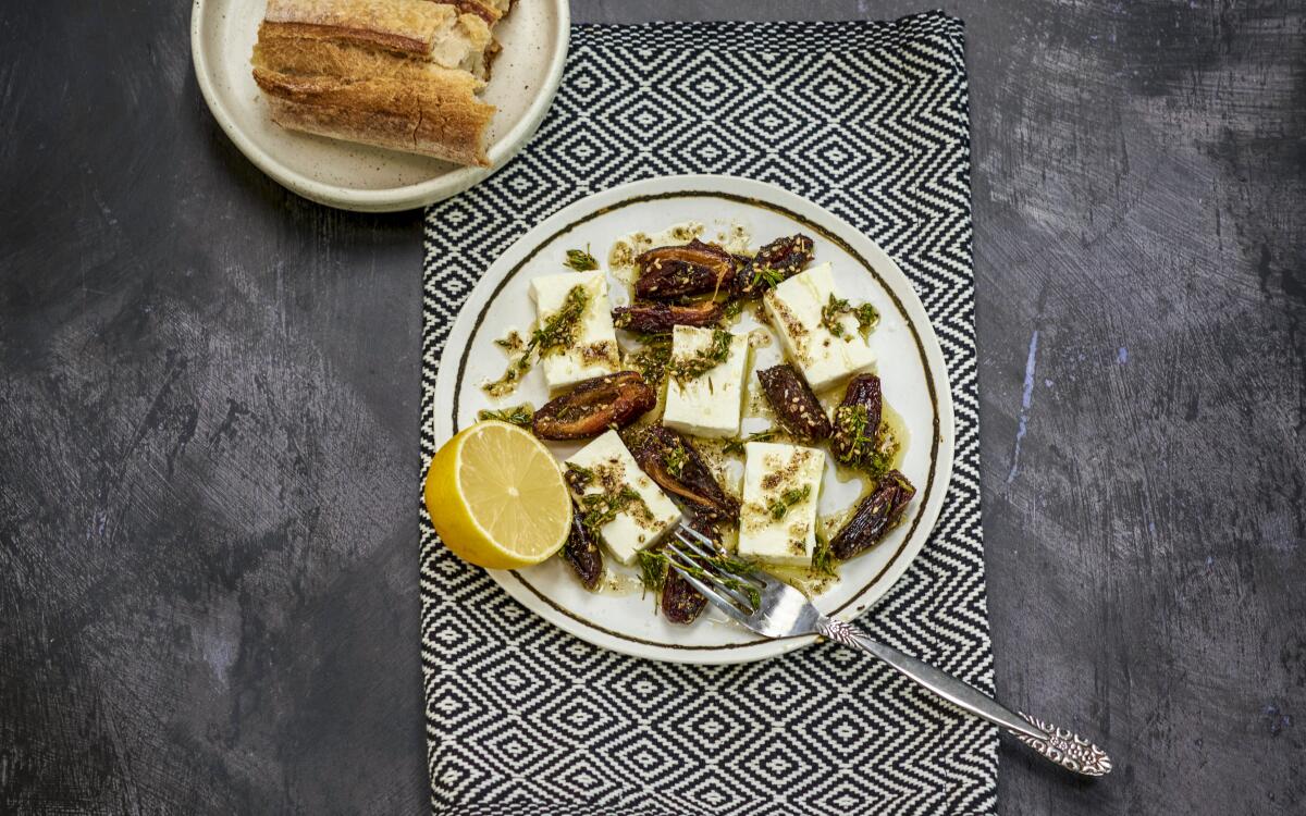 Caramelized, hot dates pair well with cold, creamy feta — all slicked in za'atar-infused olive oil — in this easy appetizer.