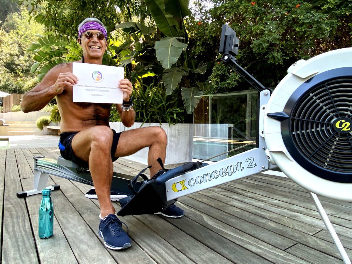 Mitch Besser, philanthropist husband of singer Annie Lennox, at his rowing machine.