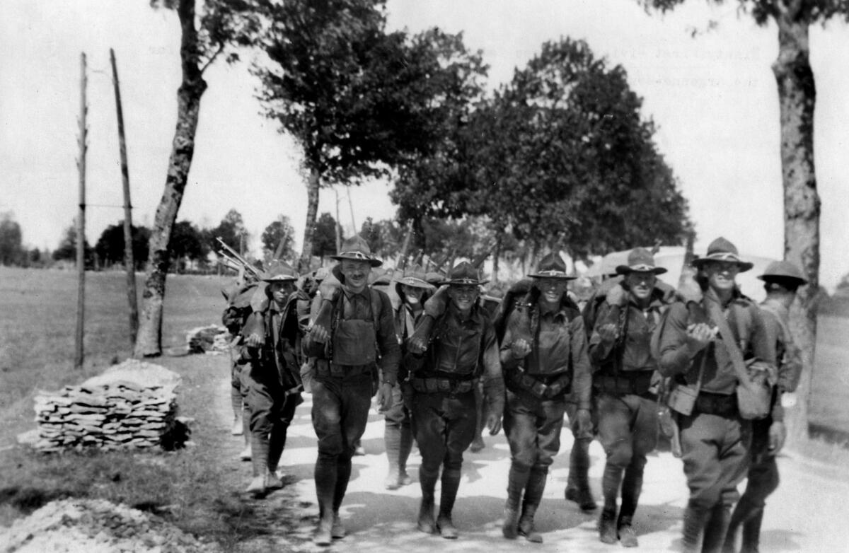 1918: Soldiers with the U.S. Army 91st Infantry Division advance to their positions in the line for the Argonne-Meuse Offensive.