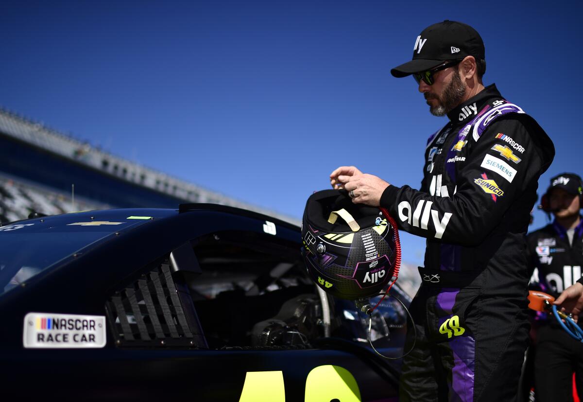 Jimmie Johnson stands on the grid during qualifying for the Daytona 500 on Feb. 9.