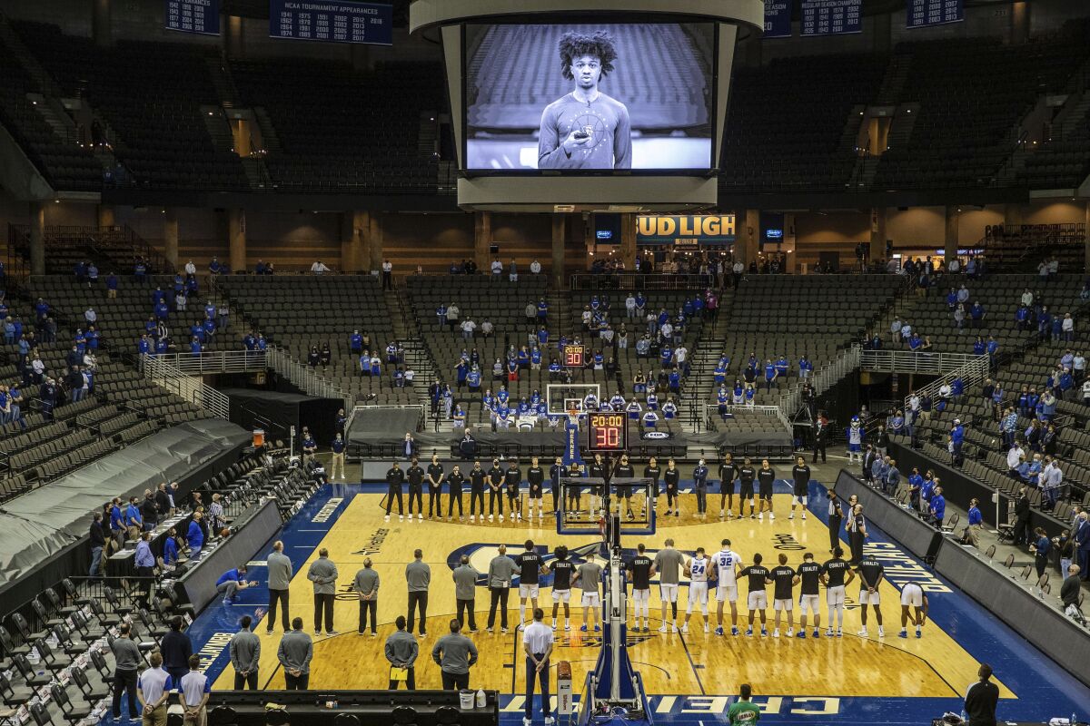 Creighton's Shereef Mitchell is among a group of players who were broadcast on the scoreboard reading a statement about suspended coach Greg McDermott, at the team's NCAA college basketball game against Butler on Saturday, March 6, 2021, in Omaha, Neb. (Chris Machian/Omaha World-Herald via AP)