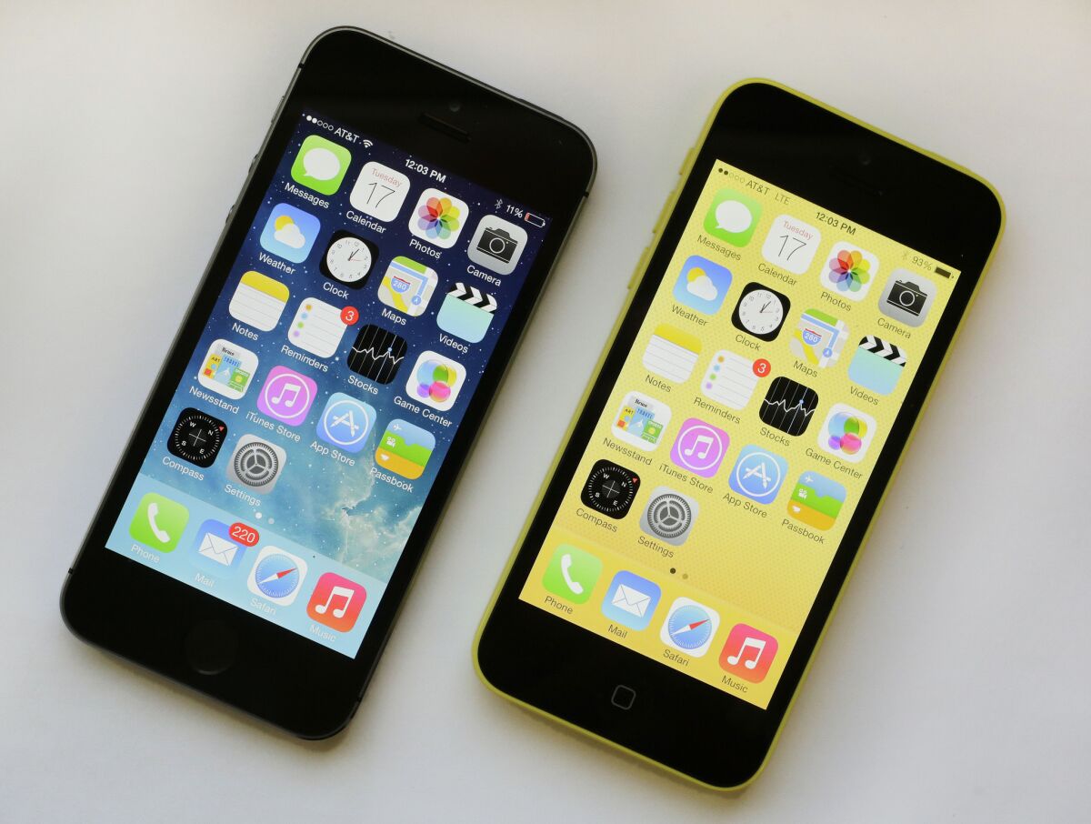 The iPhone 5s, left, and iPhone 5c are available for sale Friday.