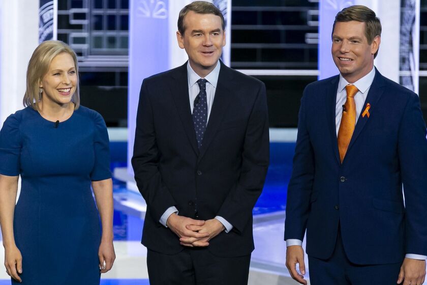 Democratic presidential candidates Sen. Kirsten Gillibrand (D-N.Y.), Sen. Michael Bennet (D-Colo.) and Rep. Eric Swalwell (D-Calif.) take the stage at the Adrienne Arsht Center for the Performing Arts in Miami on Thursday, June 27, 2019, for Day 2 of the first Democratic presidential primary debates for the 2020 elections. (Al Diaz/Miami Herald/TNS) ** OUTS - ELSENT, FPG, TCN - OUTS **