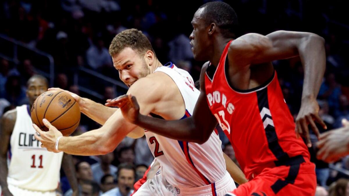 Clippers forward Blake Griffin drives to the basket against Raptors forward Pascal Siakam during the first half of a preseason game on Oct. 5.