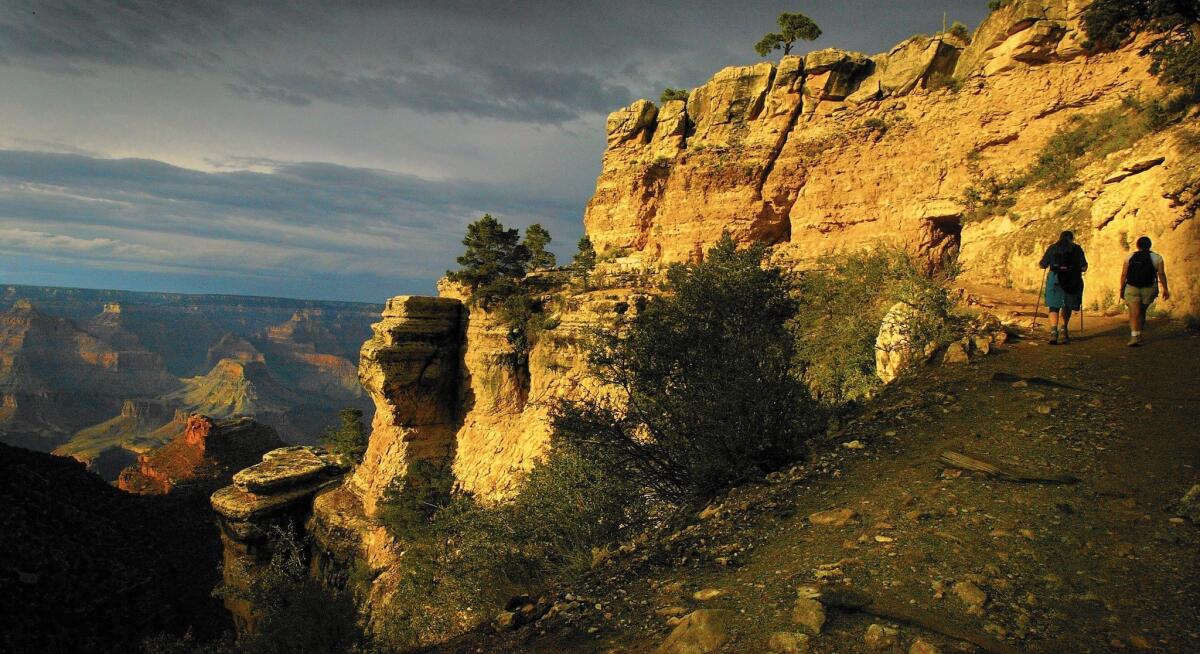 Hikers traverse the Bright Angel Trail at the Grand Canyon.