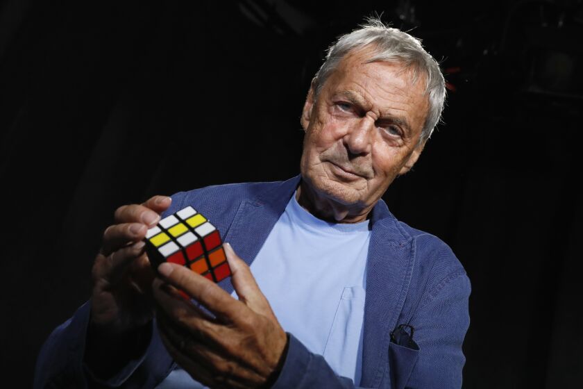 FILE - Professor Ernő Rubik, inventor of Rubik's Cube, is photographed in New York on Sept. 18, 2018. Rubik has seen his color-matching puzzle go from a classroom teaching tool in Cold War-era Hungary to a worldwide phenomenon with over 450 million cubes sold and a mini-empire of related toys. (AP Photo/Richard Drew, File)