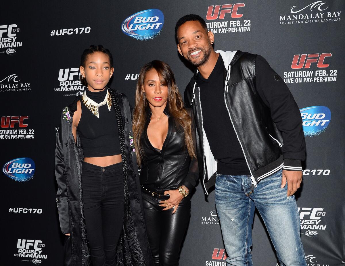 Willow Smith, left, the 13-year-old daughter of Will Smith and Jada Pinkett Smith, is the subject of controversy stirred up by a bedroom photo of her with a shirtless 20-year-old.