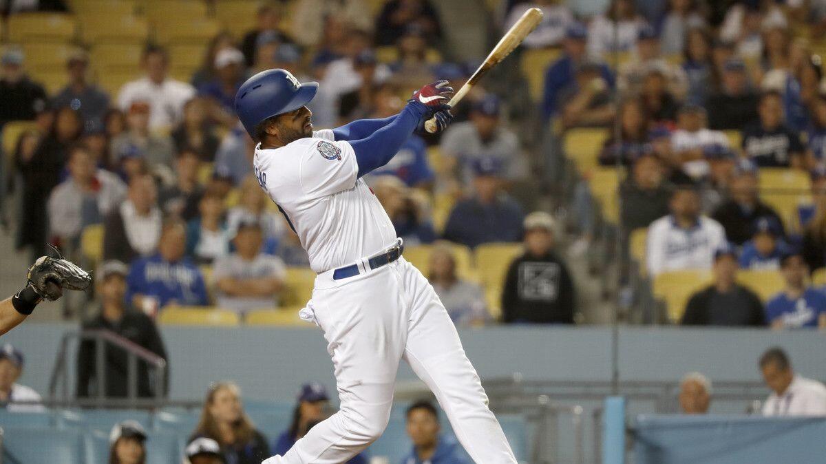 Dodgers slugger Matt Kemp hits a two-run homer in the eighth inning against the Marlins at Dodger Stadium on Wednesday.