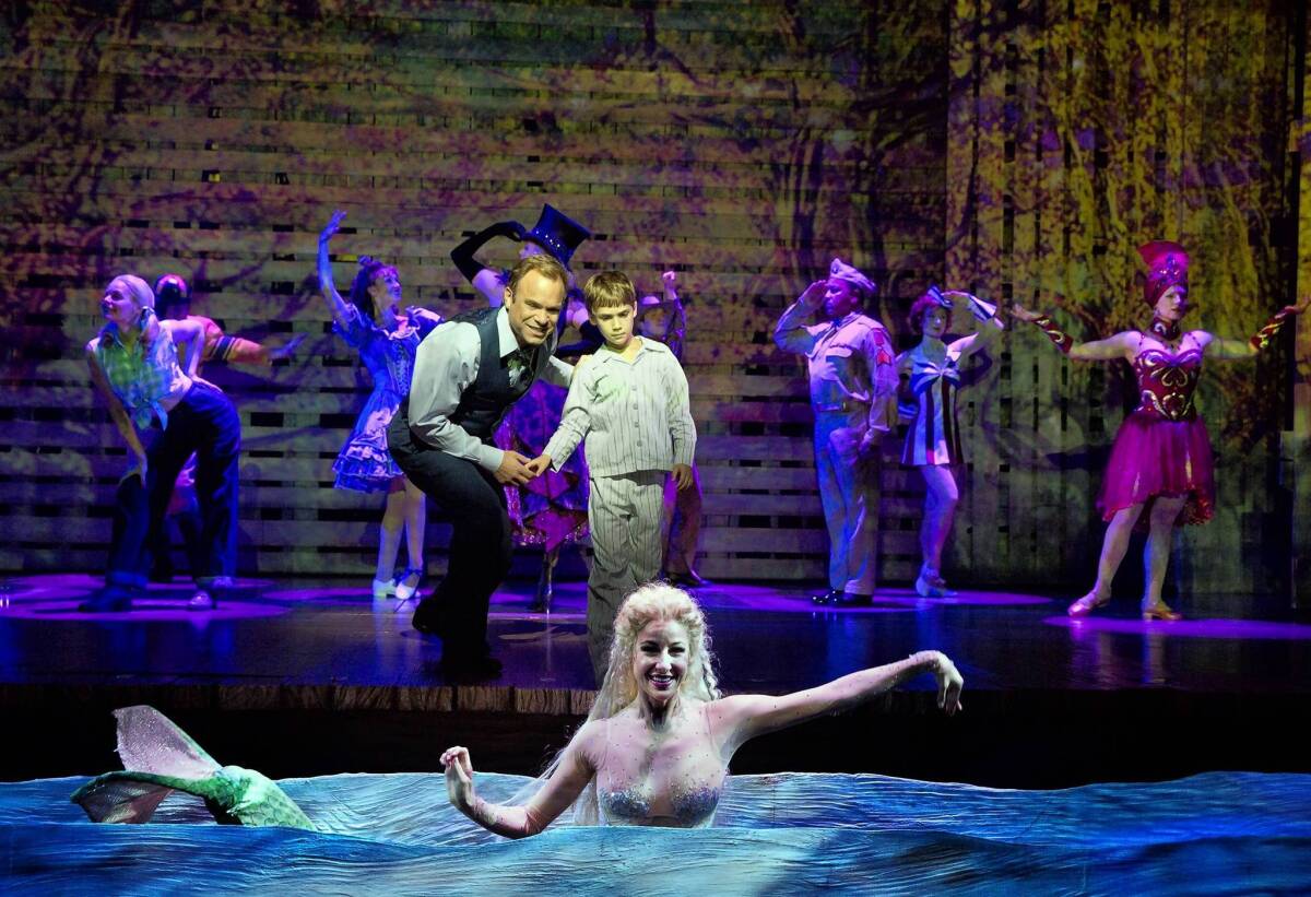 Norbert Leo Butz, Zachary Unger and Sarrah Strimel in "Big Fish" at the Neil Simon Theatre in New York.