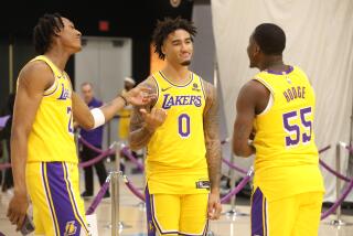 LOS ANGELES, CA - OCTOBER 2, 2023 - Los Angeles Lakers #21 Maxwell Lewis, #0 Jalen Hood-Schifino and #55 D'Moi Hodge joke around at Los Angeles Lakers Media Day at the UCLA Health Training Center in El Segundo on October 2, 2023. (Genaro Molina / Los Angeles Times)