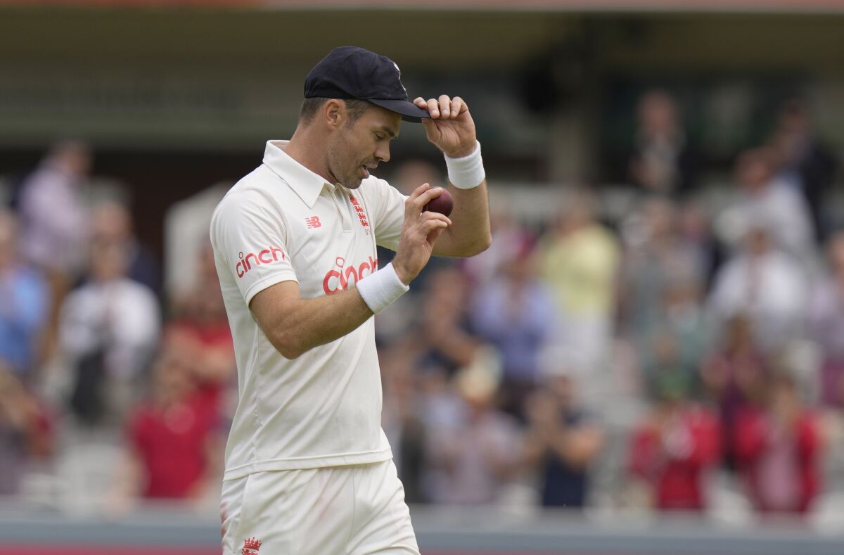 England's James Anderson celebrates after taking 5 wickets in the first innings during the second day of the 2nd cricket test between England and India at Lord's cricket ground in London, Friday, Aug. 13, 2021. (AP Photo/Alastair Grant)
