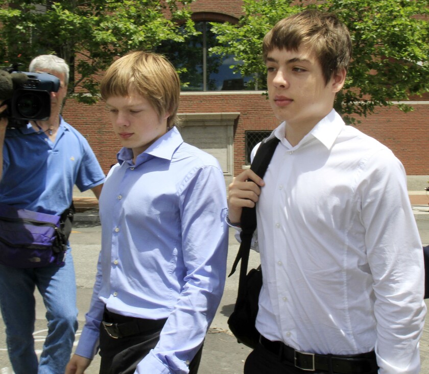 In this July 1, 2010, file photo, Alex Vavilov, right, and his older brother brother Tim leave a federal court after a bail hearing for their parents Donald Heathfield and Tracey Ann Foley, in Boston, Massachusetts. Canada's Supreme Court has ruled on Thursday, Dec. 19, 2019, that Alex Vavilov, the son of a Russian spy couple who lived clandestine lives in Canada and the United States, can keep his Canadian citizenship.