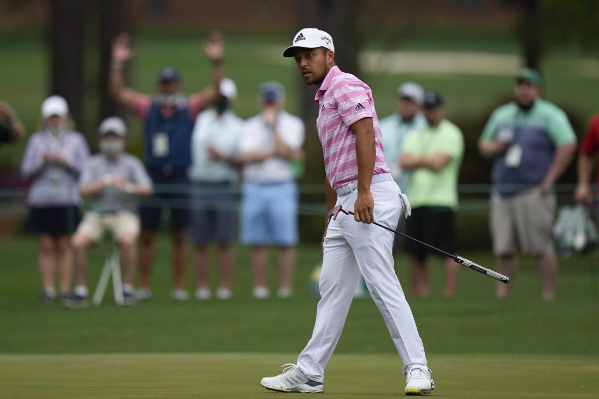 Xander Schauffele watches as his ball goes in for an eagle on the 15th hole during the third round of the Masters golf tournament on Saturday, April 10, 2021, in Augusta, Ga. (AP Photo/Matt Slocum)