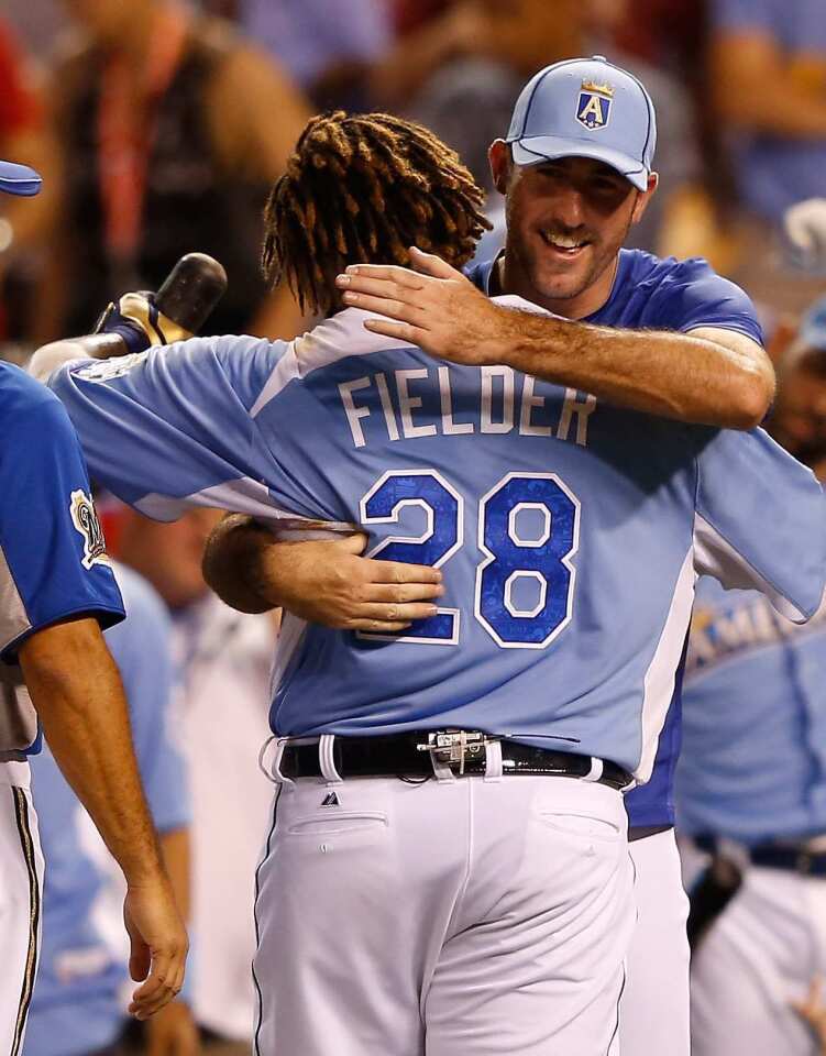 Tigers slugger Prince Fielder is congratulated by teammate Justin Verlander, who will be the starting pitcher in the All-Star game, after hitting 12 home runs in the finals of the Home Run Derby on Monday night at Kauffman Stadium in Kansas City.