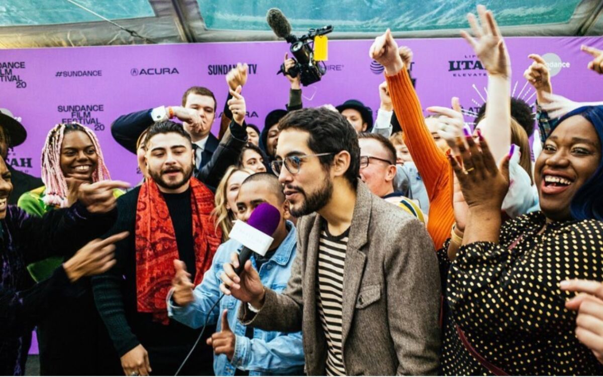 Carlos López Estrada, with the "Summertime" cast, takes the mic at the 2020 Sundance Film Festival where his film premiered.
