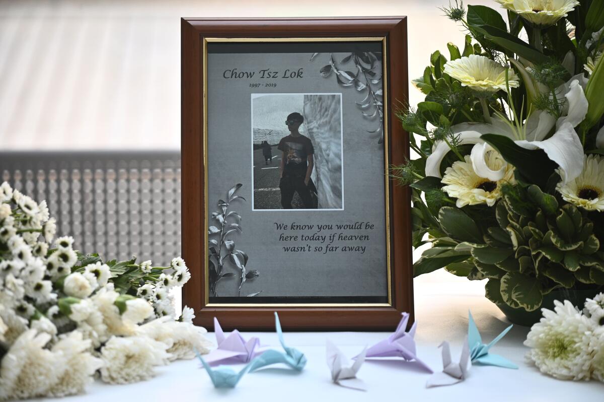 A photo of Alex Chow Tsz-lok is displayed at a makeshift memorial for him in Hong Kong.