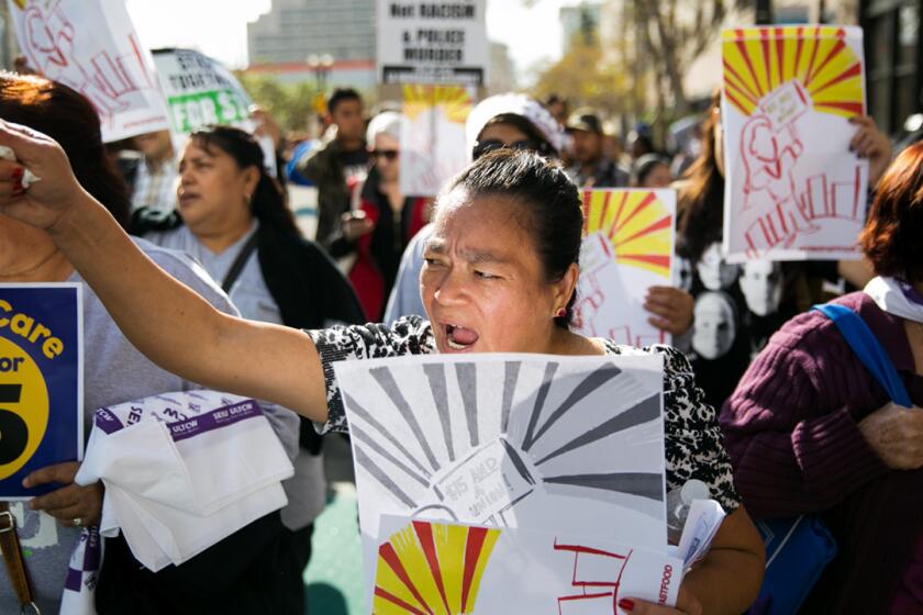 Fast-food workers and their supporters rallied in downtown Los Angeles on Thursday as part of a wave of protests planned in 160 cities around the nation advocating for $15-an-hour pay.