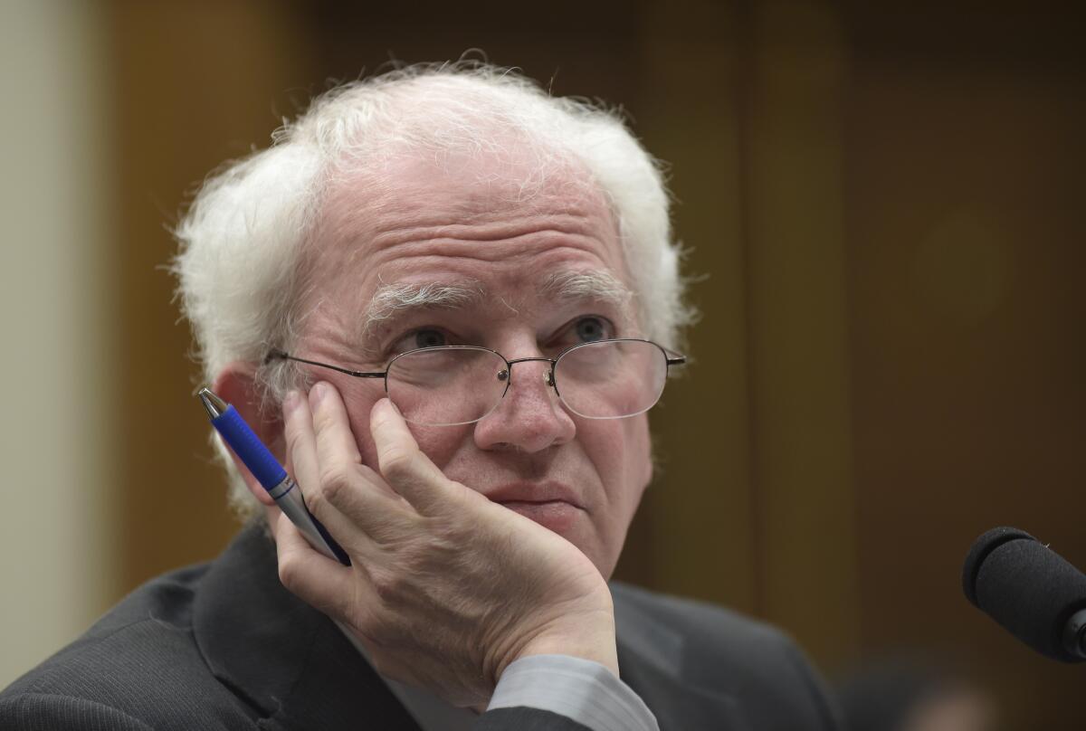 Law professor John Eastman leans on his hand during a  House Justice subcommittee hearing.