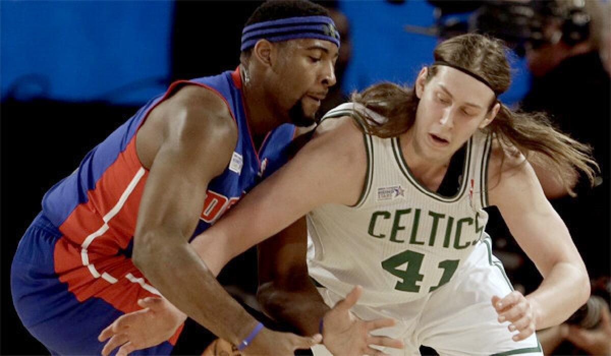 Boston's Kelly Olynyk battles for a loose ball with Detroit's Andre Drummond during the NBA Rising Stars Challenge game on Feb. 14. Olynyk and the Celtics will visit the Lakers at Staples Center on Friday.