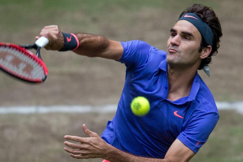 Roger Federer serves during his semifinal victory over Ivo Karlovic at the Gerry Weber Open in Halle, Germany, on Saturday.