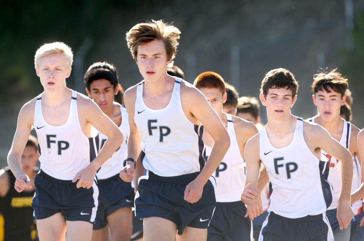 Flintridge Prep boys varsity cross country runners, led by Jack Van Scoter, center, took the league title with runners finishing in the top five spots at Prep League Cross Country Finals at Pierce College in Woodland Hills on Saturday, October 31, 2015.
